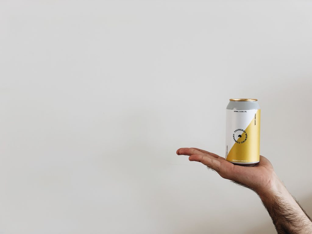 holding beer can
